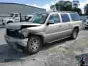 2005 Chevrolet Suburban LS z VIN 3GNFK16Z85G223199, wystawiony jako Copart lot #71655784 z przebiegiem Nie podano mil oraz Szkoda całkowita • Salvage title. Historia ofert i sprzedaży dostępna na DreamBid. Obrazek 1.