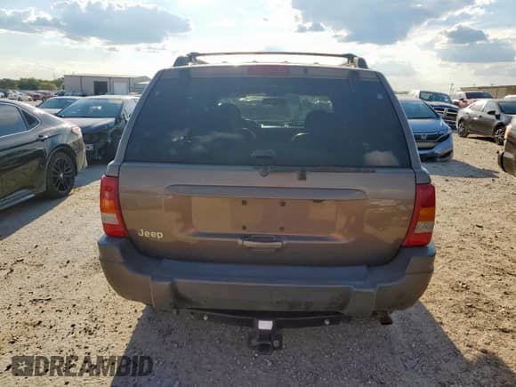 2001 Jeep Grand Cherokee Laredo с VIN 1J4GX48SX1C574879, выставлен на аукционе Copart как лот 80282945 с пробегом 237 703 миль миль и Списание • Salvage title. История ставок и продаж доступна на DreamBid. Изображение 6.