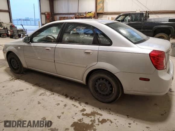 2005 Chevrolet Optra LS с VIN KL1JK59Z05K207455, выставлен на аукционе Copart как лот 79134294 с пробегом 209 198 миль миль и Чистый • Clean title. История ставок и продаж доступна на DreamBid. Изображение 2.
