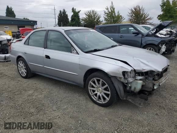 2002 Honda Accord LX with VIN 1HGCG16482A052774, listed as a Copart auction lot 71549515 with 180,194 mi miles and Salvage title. Bid and sale history available at DreamBid. Image 4.