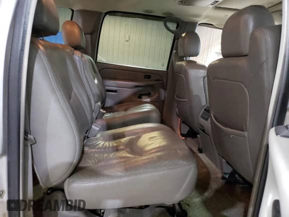 2004 Chevrolet Suburban LT z VIN 1GNEC16Z64J215186, wystawiony jako Copart lot #70231654 z przebiegiem 176 686 mil mil oraz Szkoda całkowita • Salvage title. Historia ofert i sprzedaży dostępna na DreamBid. Obrazek 11.