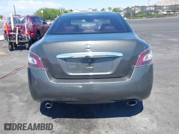 2014 Nissan Maxima S z VIN 1N4AA5AP4EC905900, wystawiony jako IAAI lot #43124050 z przebiegiem 115 628 mil mil oraz . Historia ofert i sprzedaży dostępna na DreamBid. Obrazek 14.