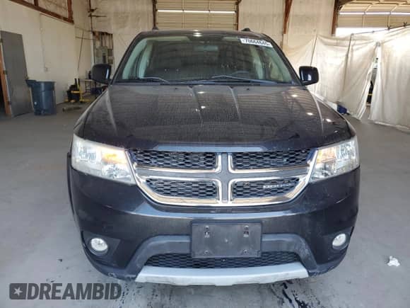 2012 Dodge Journey SXT with VIN 3C4PDCBG0CT144203, listed as a Copart auction lot 70664645 with 135,455 mi miles and Salvage title. Bid and sale history available at DreamBid. Image 5.