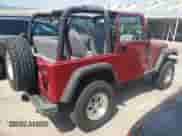 1998 Jeep Wrangler Sport z VIN 1J4FY19S9WP761133, wystawiony jako Copart lot #65012245 z przebiegiem 200 759 mil mil oraz Szkoda całkowita • Salvage title. Historia ofert i sprzedaży dostępna na DreamBid. Obrazek 3.