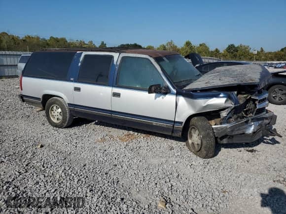 1994 Chevrolet Suburban with VIN 1GNEC16K1RJ410333, listed as a Copart auction lot 84595075 with 311,147 mi miles and Salvage title. Bid and sale history available at DreamBid. Image 4.