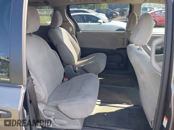 2018 Toyota Sienna L with VIN 5TDZZ3DCXJS910093, listed as a IAAI auction lot 42821908 with 98,729 mi miles and . Bid and sale history available at DreamBid. Image 8.