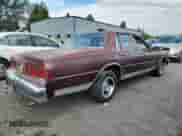 1984 Chevrolet Caprice z VIN 1G1AN69H0EH138172, wystawiony jako Copart lot #72030645 z przebiegiem Nie podano mil oraz Szkoda całkowita • Salvage title. Historia ofert i sprzedaży dostępna na DreamBid. Obrazek 3.