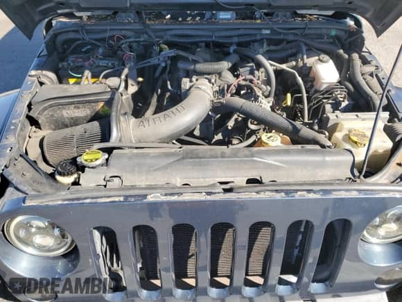 2007 Jeep Wrangler Unlimited Sahara z VIN 1J4GA591X7L147255, wystawiony jako Copart lot #82341025 z przebiegiem 189 755 mil mil oraz Czysty tytuł • Clean title. Historia ofert i sprzedaży dostępna na DreamBid. Obrazek 12.