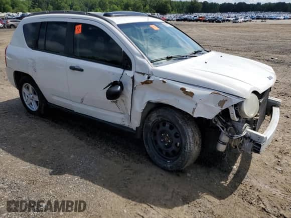 2007 Jeep Compass Sport with VIN 1J8FT47W07D107774, listed as a Copart auction lot 56740335 with 218,850 mi miles and Salvage title. Bid and sale history available at DreamBid. Image 4.