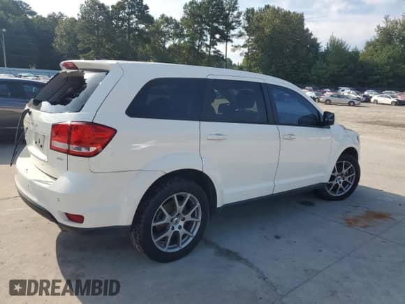 2019 Dodge Journey GT z VIN 3C4PDDEG7KT702001, wystawiony jako Copart lot #69807595 z przebiegiem 94 996 mil mil oraz Czysty tytuł • Clean title. Historia ofert i sprzedaży dostępna na DreamBid. Obrazek 3.