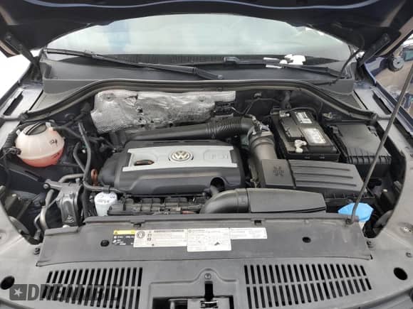 2013 Volkswagen Tiguan SE z VIN WVGAV3AX9DW056696, wystawiony jako Copart lot #54721695 z przebiegiem 108 656 mil mil oraz Szkoda całkowita • Salvage title. Historia ofert i sprzedaży dostępna na DreamBid. Obrazek 12.