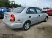 2002 Hyundai Accent GL z VIN KMHCG45C12U398748, wystawiony jako Copart lot #82077055 z przebiegiem 175 456 mil mil oraz Czysty tytuł • Clean title. Historia ofert i sprzedaży dostępna na DreamBid. Obrazek 3.
