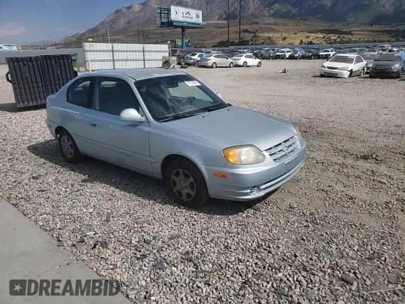 2005 Hyundai Accent GLS z VIN KMHCG35C55U341192, wystawiony jako Copart lot #70708994 z przebiegiem 174 872 mil mil oraz Szkoda całkowita • Salvage title. Historia ofert i sprzedaży dostępna na DreamBid. Obrazek 11.