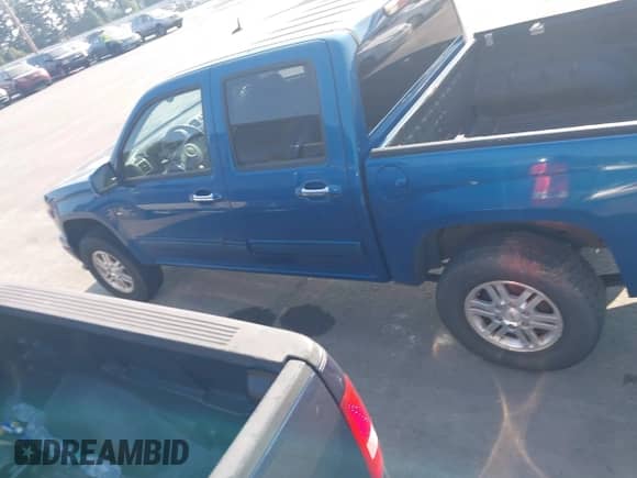 2011 Chevrolet Colorado 1LT z VIN 1GCHTCFE8B8133074, wystawiony jako IAAI lot #43024551 z przebiegiem 203 594 mil mil oraz . Historia ofert i sprzedaży dostępna na DreamBid. Obrazek 14.