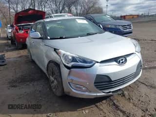 2017 Hyundai Veloster z VIN KMHTC6AD6HU310694, wystawiony jako IAAI lot #41734446 z przebiegiem 99 432 mil mil oraz . Historia ofert i sprzedaży dostępna na DreamBid. Obrazek 1.