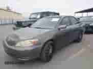 2003 Toyota Camry LE with VIN JTDBE32K130230810, listed as a IAAI auction lot 43552834 with 199,383 mi miles and . Bid and sale history available at DreamBid. Image 2.