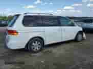 2002 Honda Odyssey EX z VIN 2HKRL18682H551537, wystawiony jako Copart lot #84208275 z przebiegiem 128 632 mil mil oraz Szkoda całkowita • Salvage title. Historia ofert i sprzedaży dostępna na DreamBid. Obrazek 3.