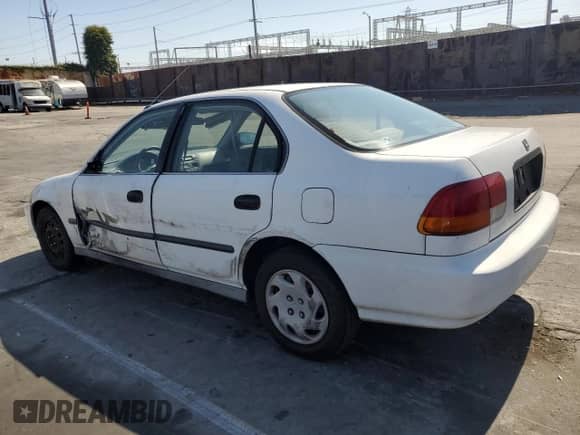 1996 Honda Civic with VIN 1HGEJ6500TL033843, listed as a Copart auction lot 55334335 with 131,654 mi miles and Salvage title. Bid and sale history available at DreamBid. Image 2.