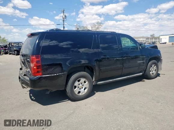 2011 Chevrolet Suburban LS с VIN 1GNSCHE02BR397286, выставлен на аукционе Copart как лот 70045315 с пробегом 216 496 миль миль и Списание • Salvage title. История ставок и продаж доступна на DreamBid. Изображение 3.