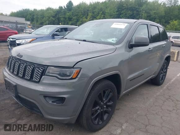 2020 Jeep Grand Cherokee Laredo E with VIN 1C4RJFAG6LC176718, listed as a IAAI auction lot 43043174 with 128,424 mi miles and . Bid and sale history available at DreamBid. Image 2.