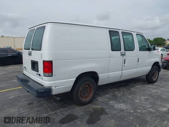 2013 Ford Econoline Cargo Commercial with VIN 1FTNE1EW1DDA90039, listed as a IAAI auction lot 42439049 with 218,937 mi miles and . Bid and sale history available at DreamBid. Image 4.