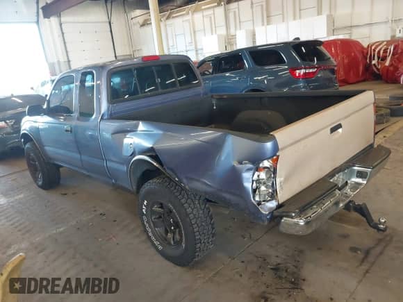 2000 Toyota Tacoma with VIN 4TAWM72N5YZ650056, listed as a IAAI auction lot 41680278 with 257,819 mi miles and . Bid and sale history available at DreamBid. Image 3.