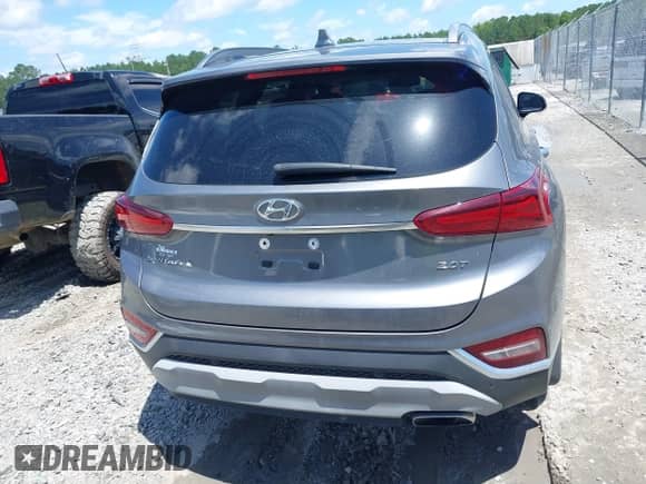 2019 Hyundai Santa Fe Limited with VIN 5NMS53AA8KH019448, listed as a IAAI auction lot 42523814 with 105,414 mi miles and . Bid and sale history available at DreamBid. Image 16.