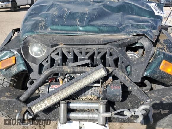 2005 Jeep Wrangler SE z VIN 1J4FA29175P331391, wystawiony jako Copart lot #76608824 z przebiegiem 98 268 mil mil oraz Szkoda całkowita • Salvage title. Historia ofert i sprzedaży dostępna na DreamBid. Obrazek 11.