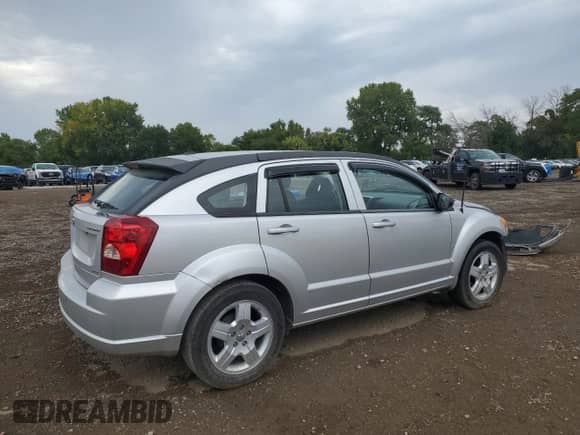 2009 Dodge Caliber SXT z VIN 1B3HB48AX9D181259, wystawiony jako Copart lot #80146215 z przebiegiem 94 695 mil mil oraz Szkoda całkowita • Salvage title. Historia ofert i sprzedaży dostępna na DreamBid. Obrazek 3.