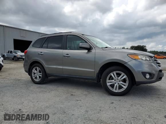 2012 Hyundai Santa Fe Limited z VIN 5XYZK3AB1CG099736, wystawiony jako Copart lot #69553945 z przebiegiem 136 052 mil mil oraz Szkoda całkowita • Salvage title. Historia ofert i sprzedaży dostępna na DreamBid. Obrazek 4.