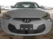 2014 Hyundai Veloster z VIN KMHTC6AD3EU214209, wystawiony jako Copart lot #69948355 z przebiegiem 144 925 mil mil oraz Szkoda całkowita • Salvage title. Historia ofert i sprzedaży dostępna na DreamBid. Obrazek 5.