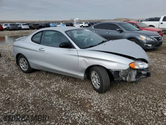 1999 Hyundai Tiburon с VIN KMHJG24F8XU126762, выставлен на аукционе Copart как лот 88747725 с пробегом 51 296 миль миль и Списание • Salvage title. История ставок и продаж доступна на DreamBid. Изображение 4.