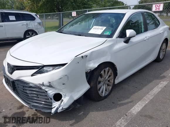 2020 Toyota Camry LE with VIN 4T1L11AKXLU329121, listed as a IAAI auction lot 43233720 with 46,485 mi miles and . Bid and sale history available at DreamBid. Image 17.