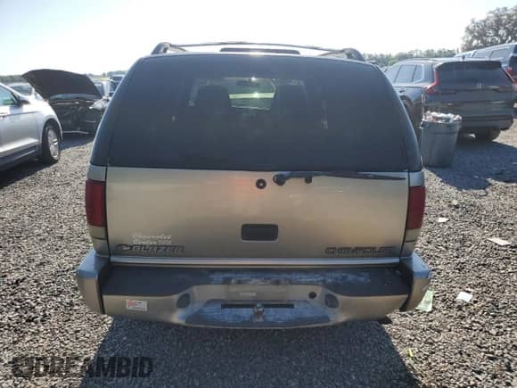 2000 Chevrolet Blazer LS z VIN 1GNCS13W7Y2376702, wystawiony jako Copart lot #52489605 z przebiegiem 137 692 mil mil oraz Szkoda całkowita • Salvage title. Historia ofert i sprzedaży dostępna na DreamBid. Obrazek 6.