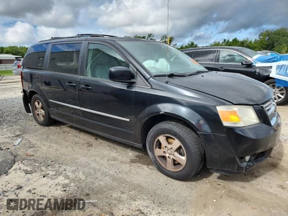 2010 Dodge Grand Caravan SXT with VIN 2D4RN5DX2AR135357, listed as a Copart auction lot 67761525 with 202,521 mi miles and Salvage title. Bid and sale history available at DreamBid. Image 4.