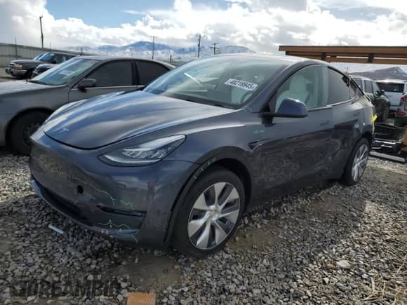 2023 Tesla Model Y Long Range z VIN 7SAYGDEE4PA147170, wystawiony jako Copart lot #48218945 z przebiegiem Nie podano mil oraz Szkoda całkowita • Salvage title. Historia ofert i sprzedaży dostępna na DreamBid. Obrazek 1.