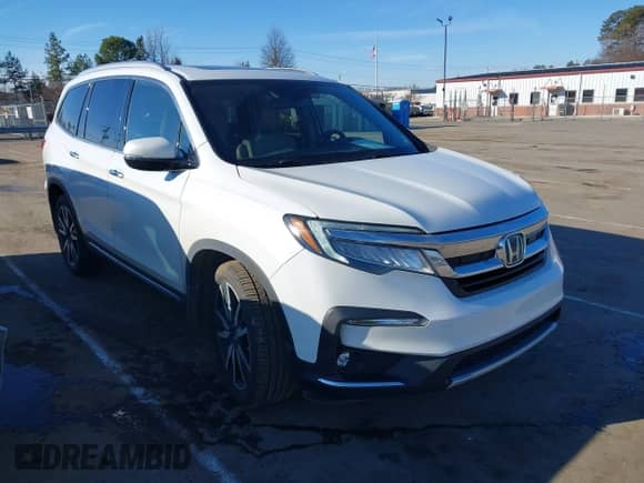 2021 Honda Pilot Touring 7-Passenger with VIN 5FNYF5H64MB031671, listed as a IAAI auction lot 41332415 with 90,411 mi miles and . Bid and sale history available at DreamBid. Image 1.