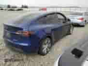 2023 Tesla Model Y Long Range with VIN 7SAYGDEE7PF849910, listed as a Copart auction lot 65620724 with Not provided miles and Salvage title. Bid and sale history available at DreamBid. Image 3.