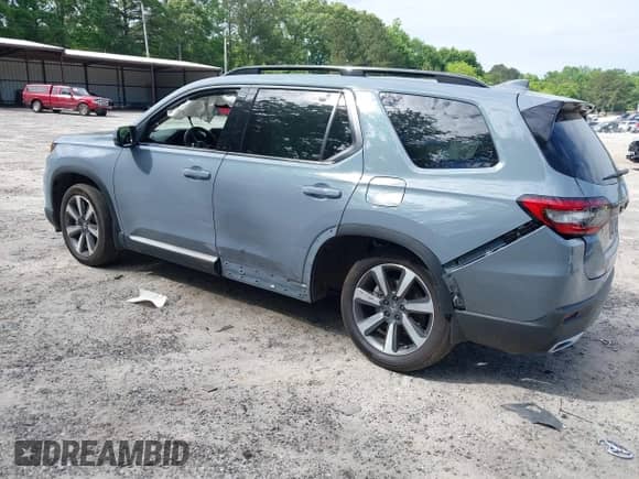 2025 Honda Pilot Touring with VIN 5FNYG2H70SB011614, listed as a IAAI auction lot 42205848 with 37,719 mi miles and . Bid and sale history available at DreamBid. Image 3.