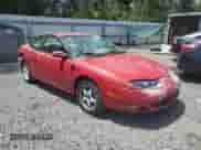 2001 Saturn SC with VIN 1G8ZY12791Z233074, listed as a Copart auction lot 60476085 with 130,323 mi miles and Salvage title. Bid and sale history available at DreamBid. Image 4.