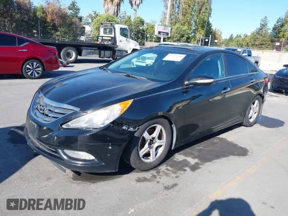 2013 Hyundai Sonata SE with VIN 5NPEC4AC2DH670705, listed as a IAAI auction lot 43283130 with 151,485 mi miles and . Bid and sale history available at DreamBid. Image 2.