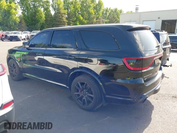 2018 Dodge Durango SRT with VIN 1C4SDJGJ5JC142443, listed as a IAAI auction lot 42401246 with 106,260 mi miles and . Bid and sale history available at DreamBid. Image 3.