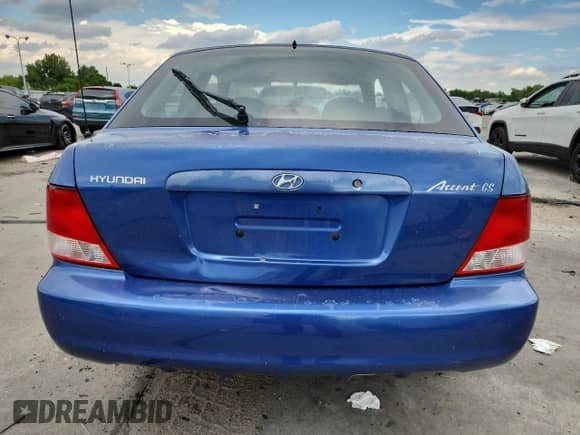 2002 Hyundai Accent GS z VIN KMHCG35C22U161535, wystawiony jako Copart lot #70580195 z przebiegiem 74 007 mil mil oraz Szkoda całkowita • Salvage title. Historia ofert i sprzedaży dostępna na DreamBid. Obrazek 6.