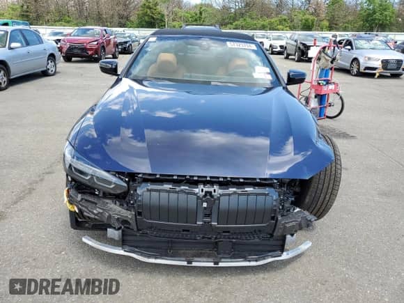 2024 BMW 4 Series 430i xDrive with VIN WBA43AT06RCP04562, listed as a Copart auction lot 57323704 with 737 mi miles and Salvage title. Bid and sale history available at DreamBid. Image 5.
