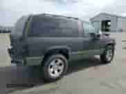 1998 Chevrolet Tahoe z VIN 3GNEK18R8WG130659, wystawiony jako Copart lot #81615845 z przebiegiem 308 784 mil mil oraz Szkoda całkowita • Salvage title. Historia ofert i sprzedaży dostępna na DreamBid. Obrazek 3.