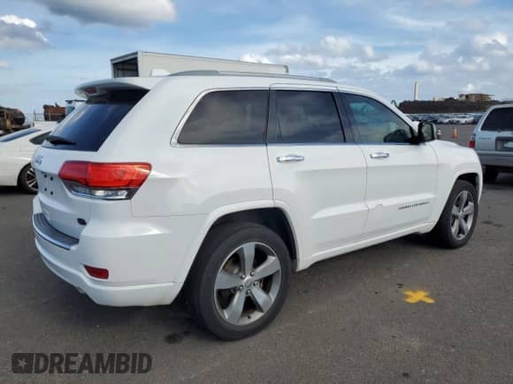 2015 Jeep Grand Cherokee Overland z VIN 1C4RJECG0FC105302, wystawiony jako Copart lot #65759165 z przebiegiem 104 358 mil mil oraz Szkoda całkowita • Salvage title. Historia ofert i sprzedaży dostępna na DreamBid. Obrazek 3.