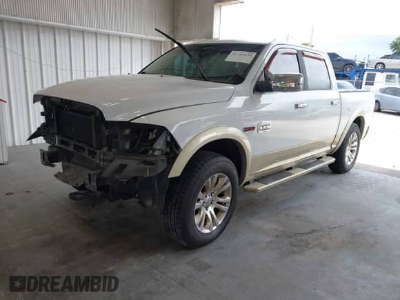 2014 Ram 1500 Longhorn z VIN 1C6RR7PM7ES353935, wystawiony jako IAAI lot #42781639 z przebiegiem 187 049 mil mil oraz . Historia ofert i sprzedaży dostępna na DreamBid. Obrazek 2.