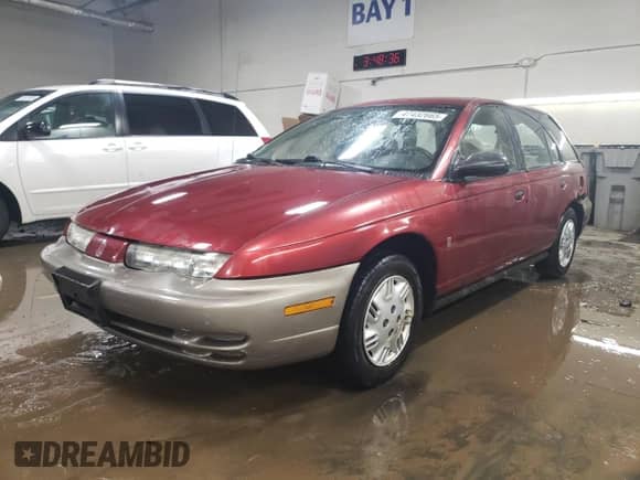 1997 Saturn SW with VIN 1G8ZH8283VZ404571, listed as a Copart auction lot 47432665 with 100,707 mi miles and Salvage title. Bid and sale history available at DreamBid. Image 1.