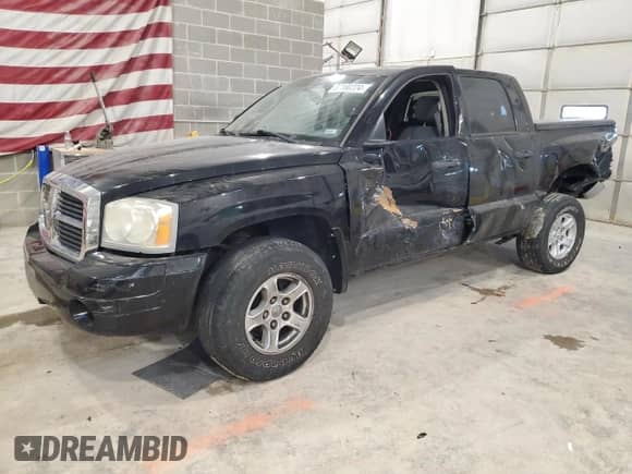 2006 Dodge Dakota SLT z VIN 1D7HW48KX6S535595, wystawiony jako Copart lot #87180224 z przebiegiem 159 168 mil mil oraz Szkoda całkowita • Salvage title. Historia ofert i sprzedaży dostępna na DreamBid. Obrazek 1.