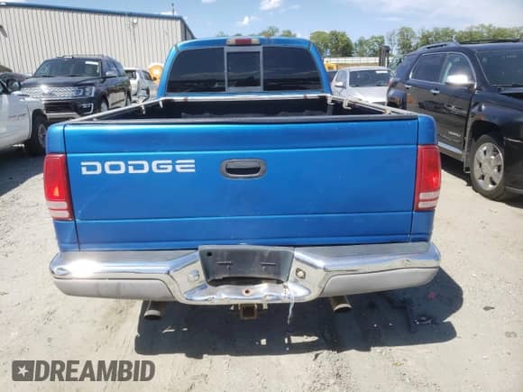 1999 Dodge Dakota SLT with VIN 1B7GL22XXXS147047, listed as a Copart auction lot 57552215 with 288,196 mi miles and Salvage title. Bid and sale history available at DreamBid. Image 6.